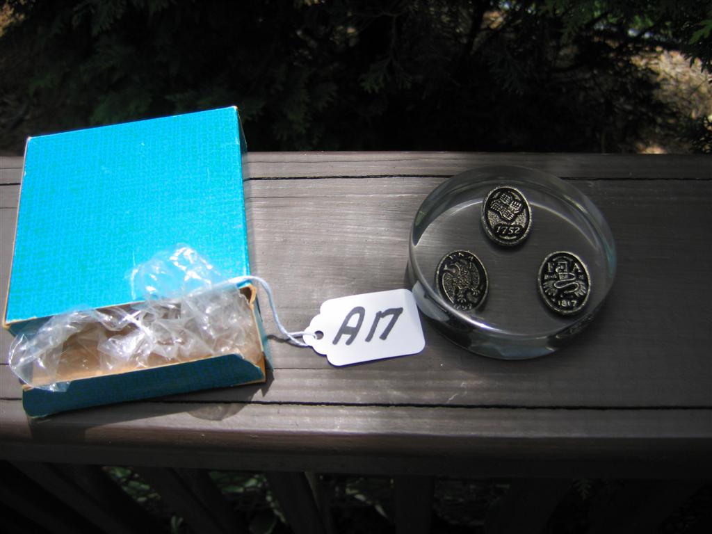 Paperweight. Lucite 2 7/8" diameter with 3 small