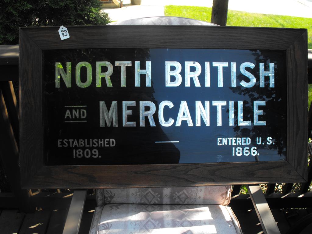 North British and Mercantile Reverse Glass Sign.