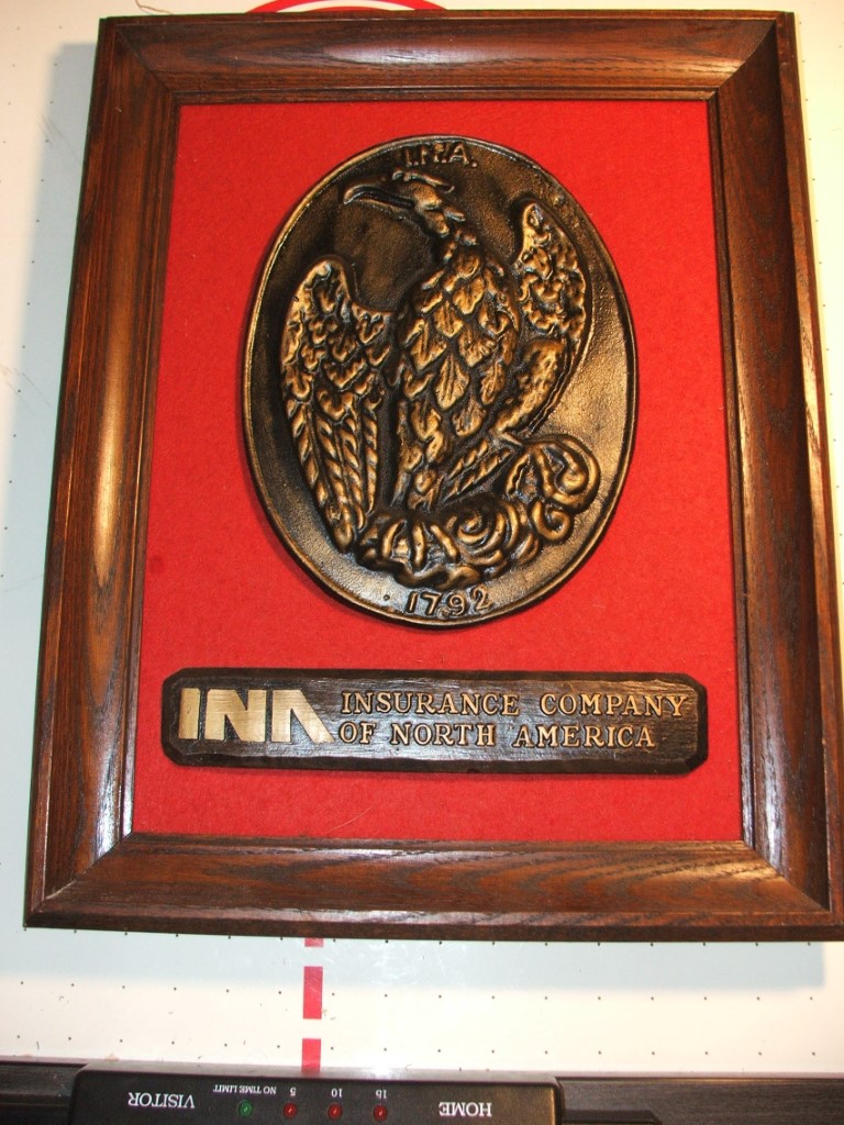 15.5" x 20" office plaque for INA. Real wood fram