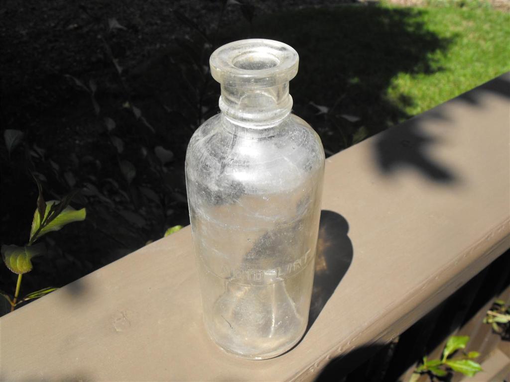 Acid Bottle. Clear bottle with no markings except