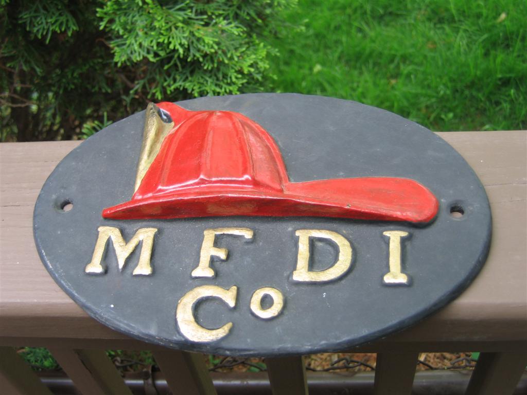 M F Di Co. Reproduction Fire Mark. Red Fire Helme