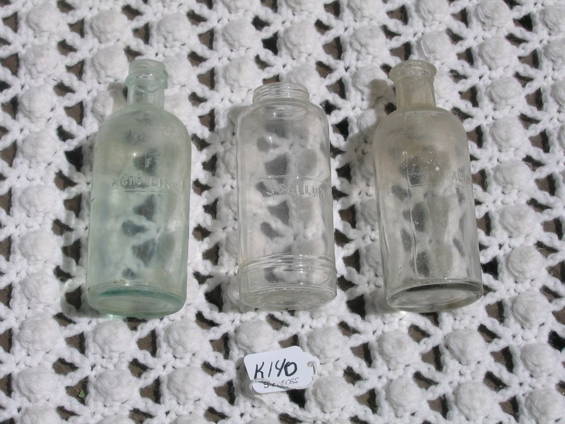 Three Acid Glass Bottles. Two have "Acid Line" et