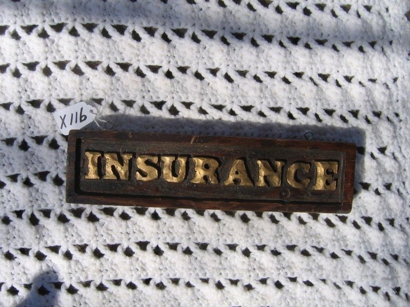 Small Wood Sign that says "INSURANCE". 11 1/2X3.