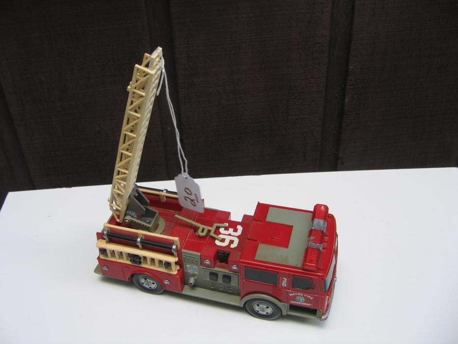 #020 Plastic toy fire truck. Made in China. 9 inches long. 3 inches wide, 3 inches high.