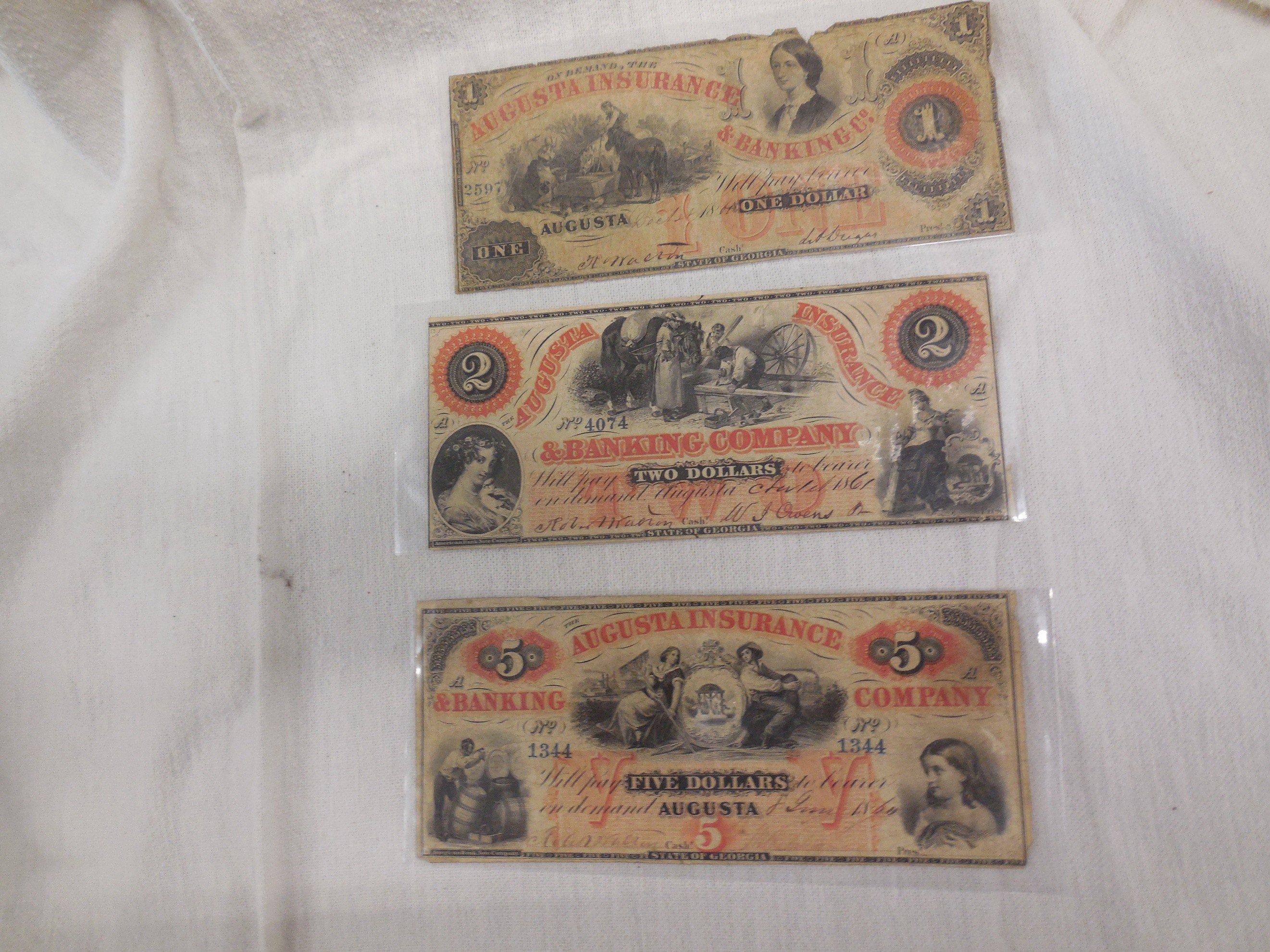 Augusta Insurance Company currency - $1, $3, and $5