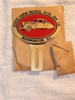 State Farm bumper emblem. Painted steel. Dates to