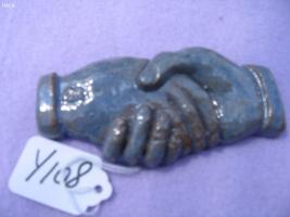 Shaking Hands. Clay with Blue and Brown Glaze on