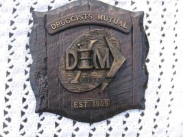 Druggists Mutual Plaque. 11 1/4x11. Composite Ma