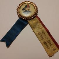 Neat old pin depicting a fireman with red, white a