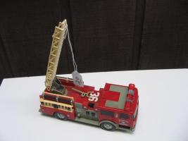 #020 Plastic toy fire truck. Made in China. 9 inches long. 3 inches wide, 3 inches high.